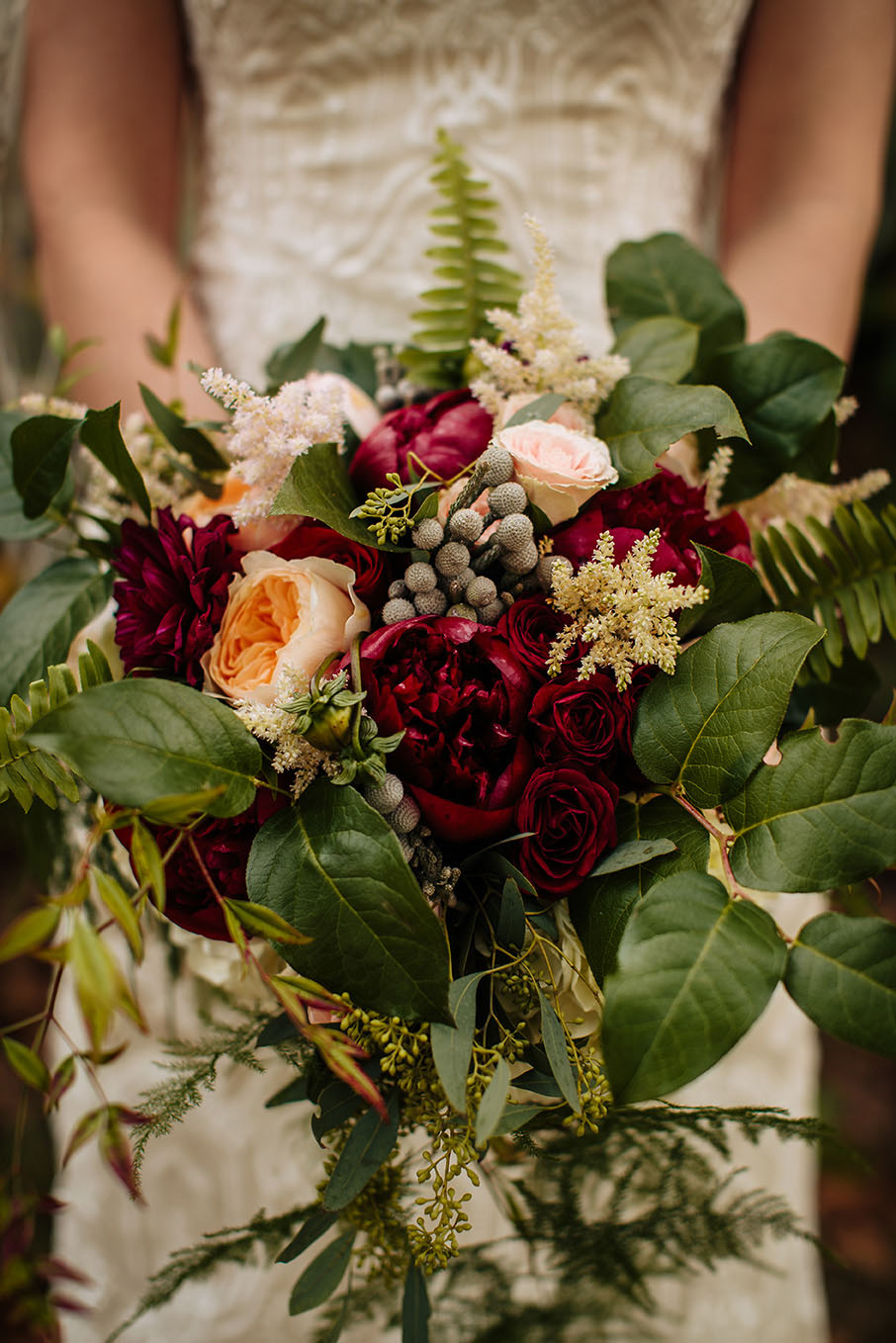 Meghan Holding Cascade-Style Burgundy Bridal Bouquet
