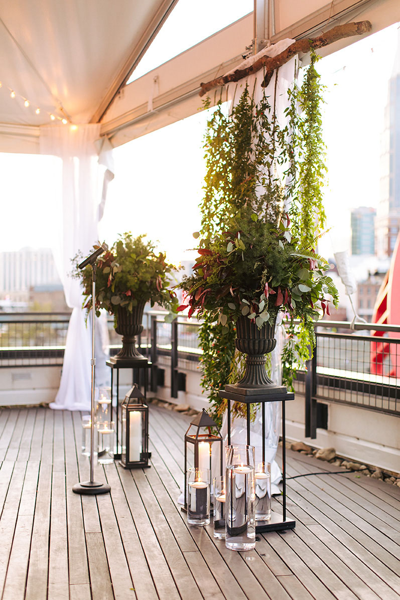 Fall Rooftop Wedding Ceremony With Greenery Altar with Black Lanterns