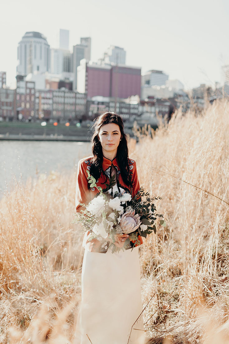 Chelsey in Red Vintage Kimono Jacket Holding Protea Bridal Bouquet