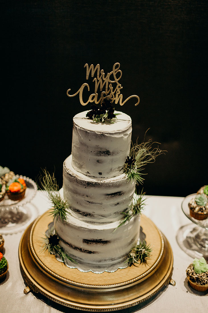 Three-Tiered Naked Cake With Greenery and Custom Gold Topper