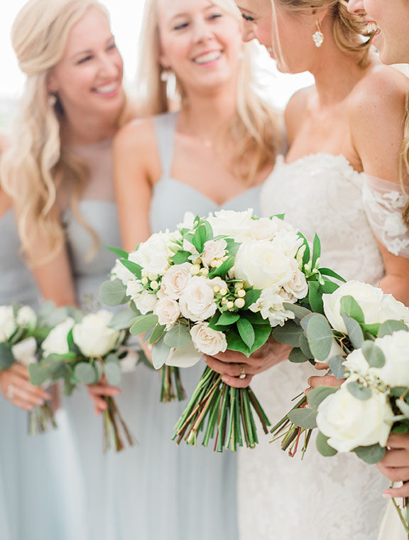 Lauren and Bridesmaids Holding Green and White Bouquets