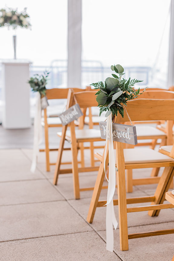 Light Wooden Wedding Ceremony Seating with Greenery Aisle Markers