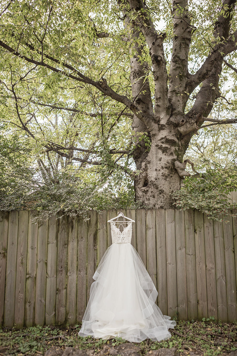 Wedding Dress Hanging on Fence