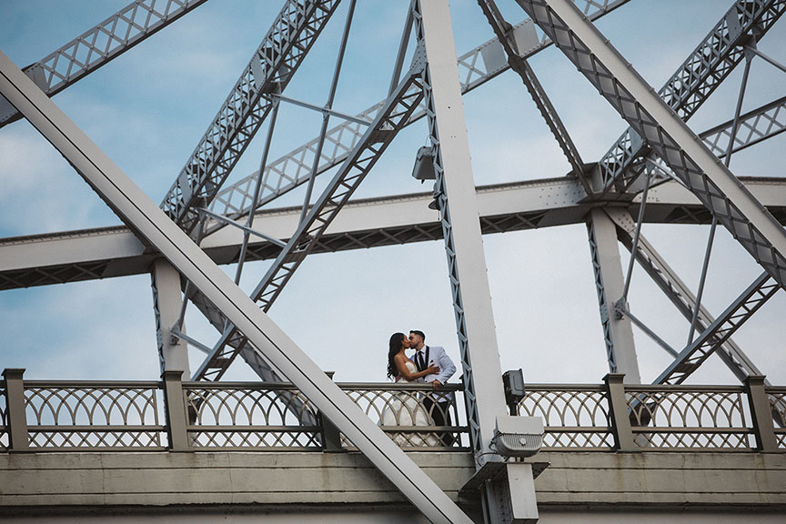 Neysha and Joel Kissing on Pedestrian Bridge