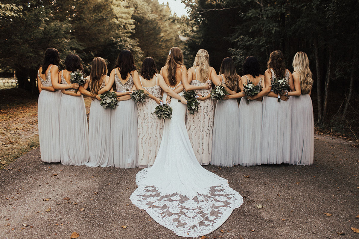 Chloe and Bridesmaids With Arms Around Waists