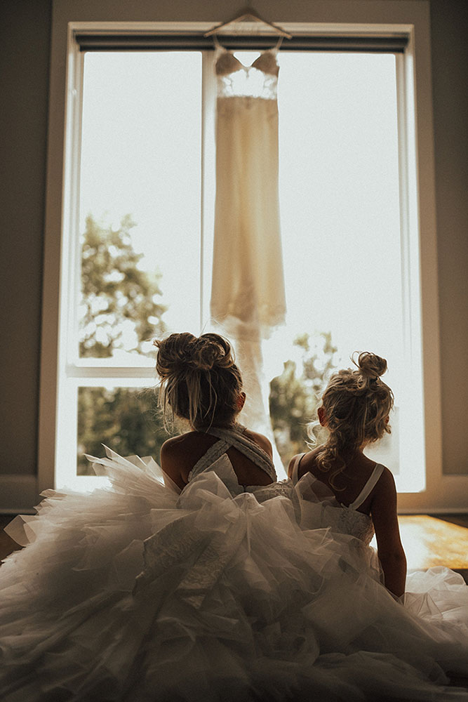 Chloe's Flower Girls Looking at Her Wedding Dress
