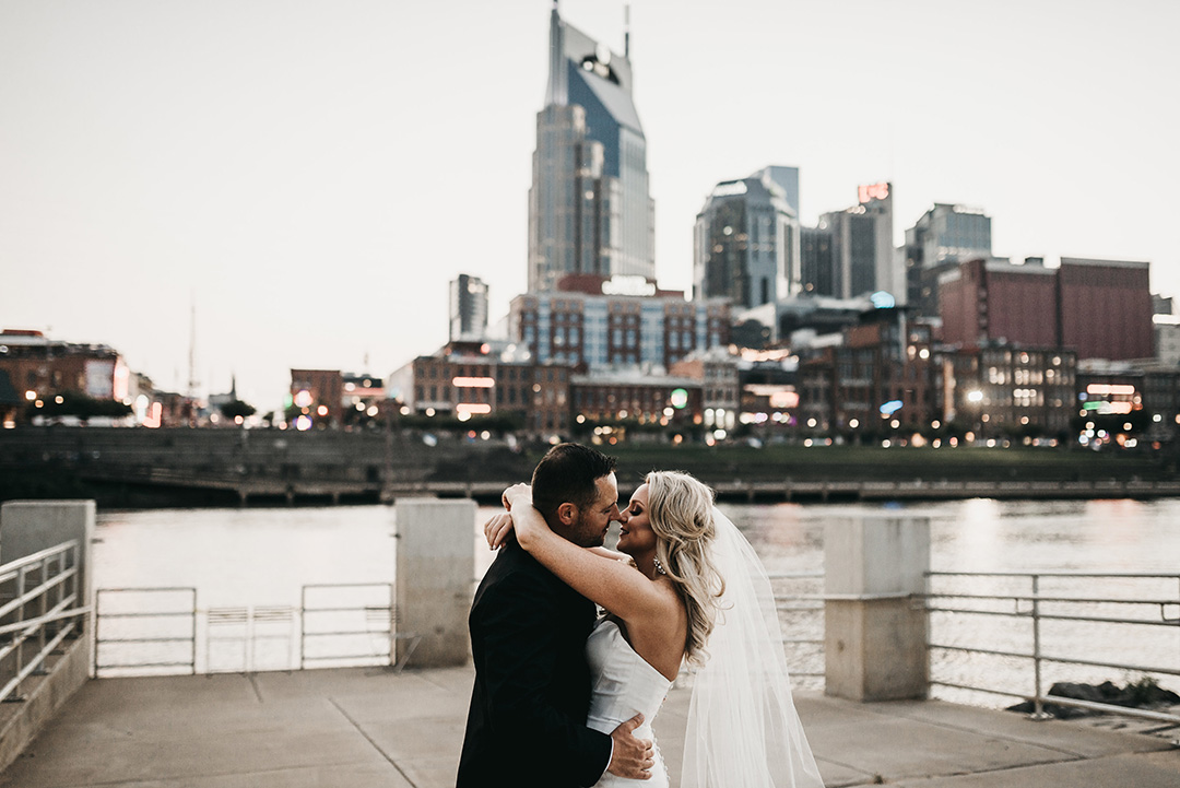 Lacey and Brandon Embracing on Riverfront