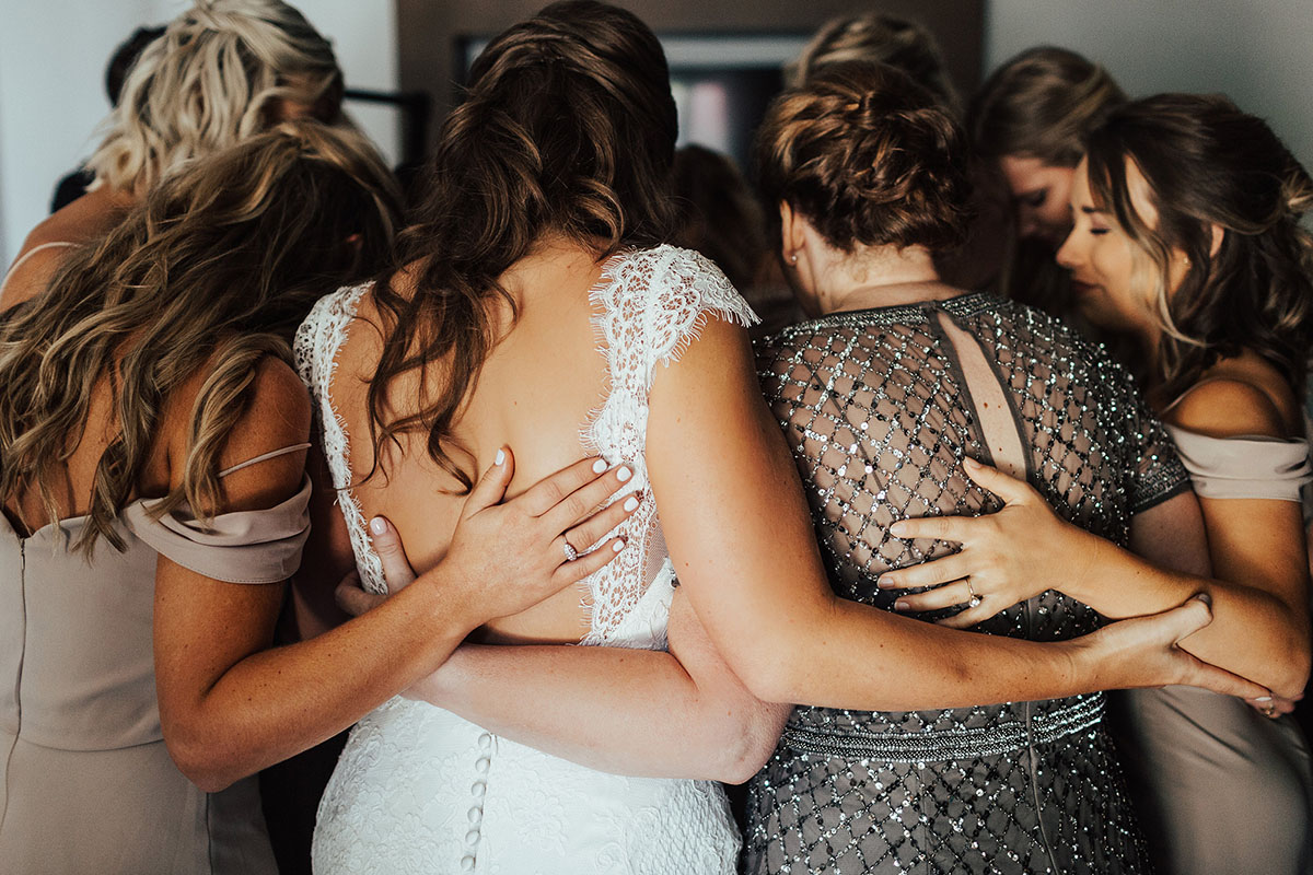 Bride Hugging Mom and Bridesmaids before Ceremony