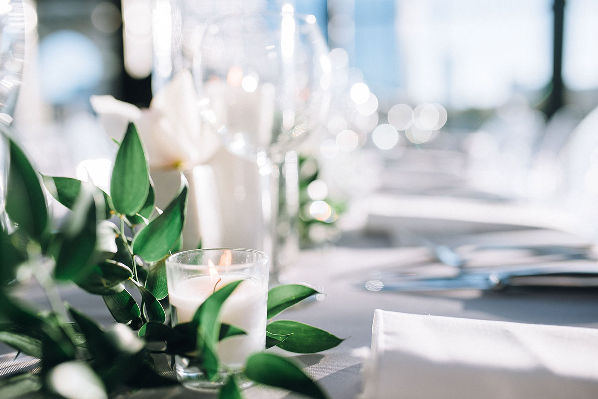 White Candle Decor with Greenery