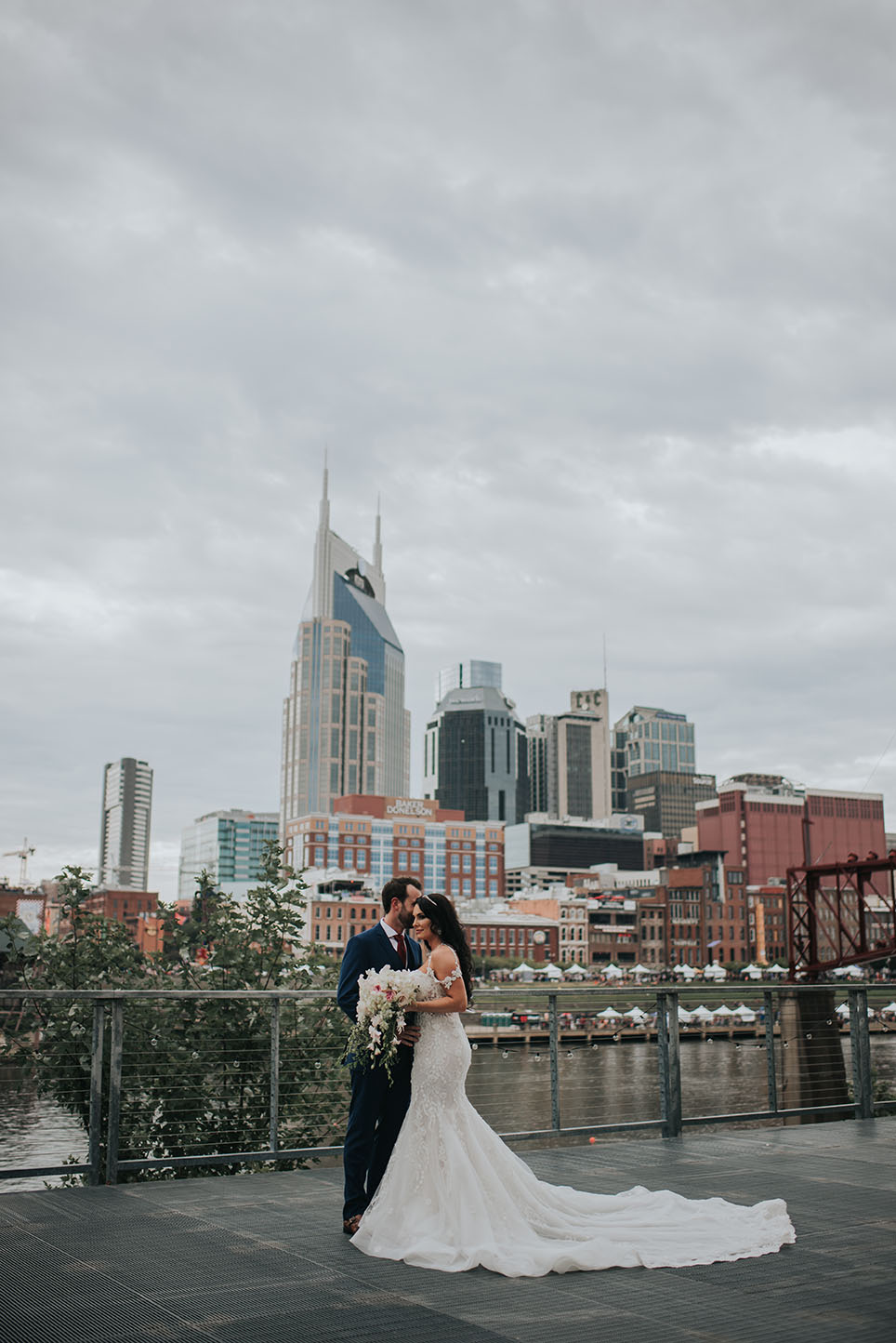 Ashley and Justin Standing on Riverfront