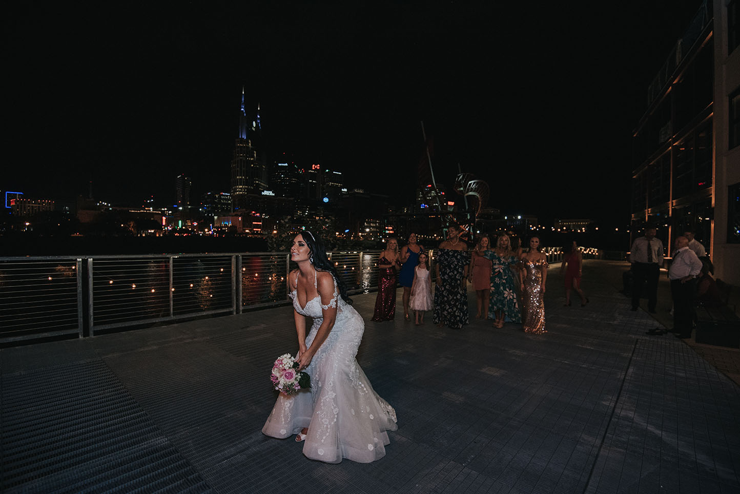 Ashley Tossing Bouquet on Riverfront