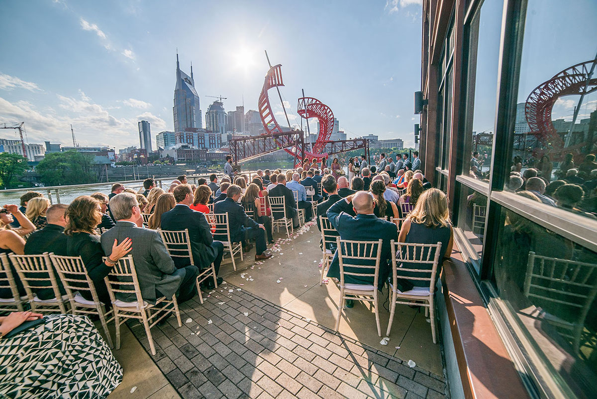 Guests Seated at Riverfront Wedding Ceremony