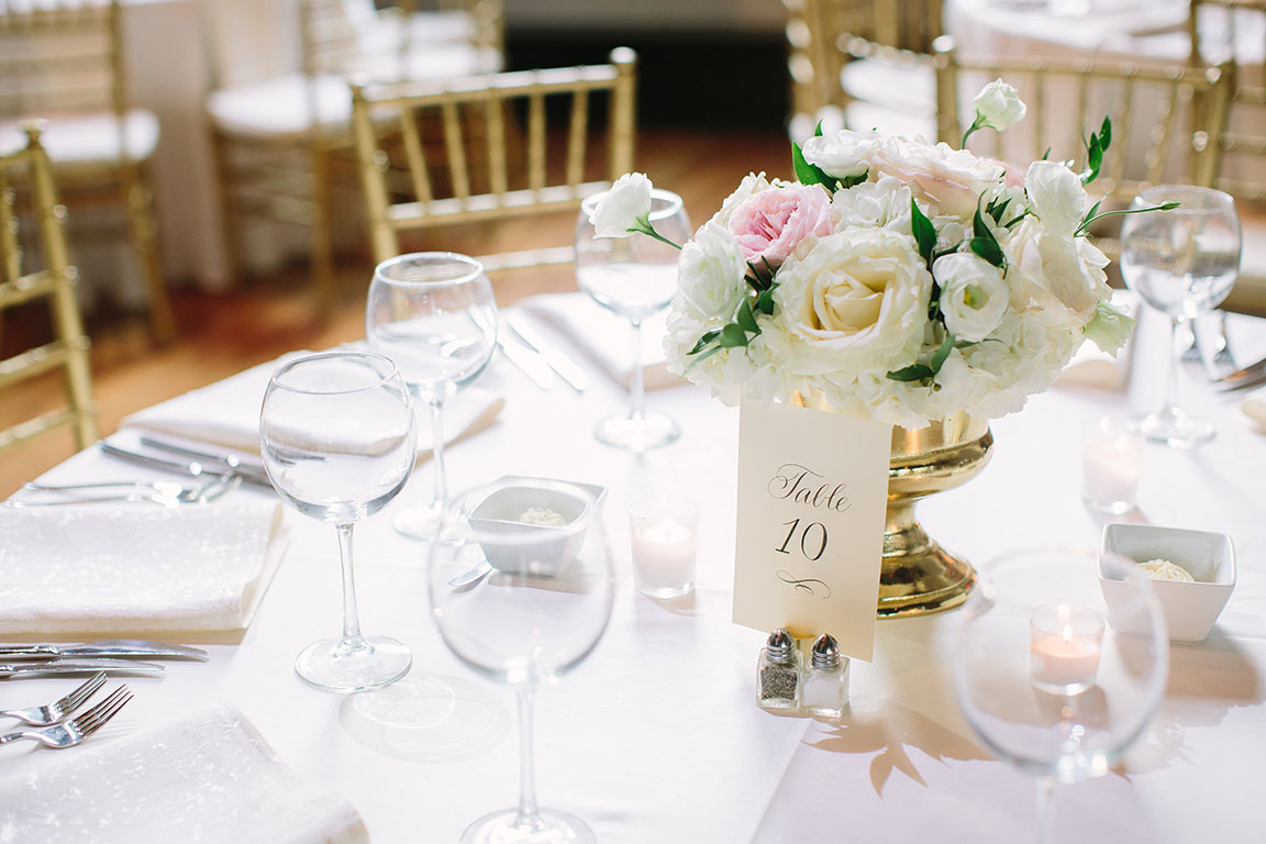 White Table Setting with Florals and Gold Chiavari Seating