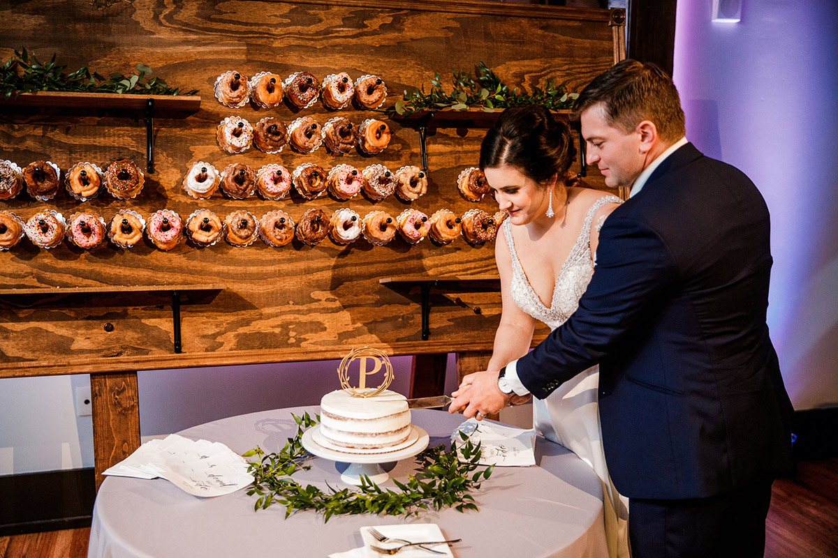 Kasey and George Cutting Wedding Cake