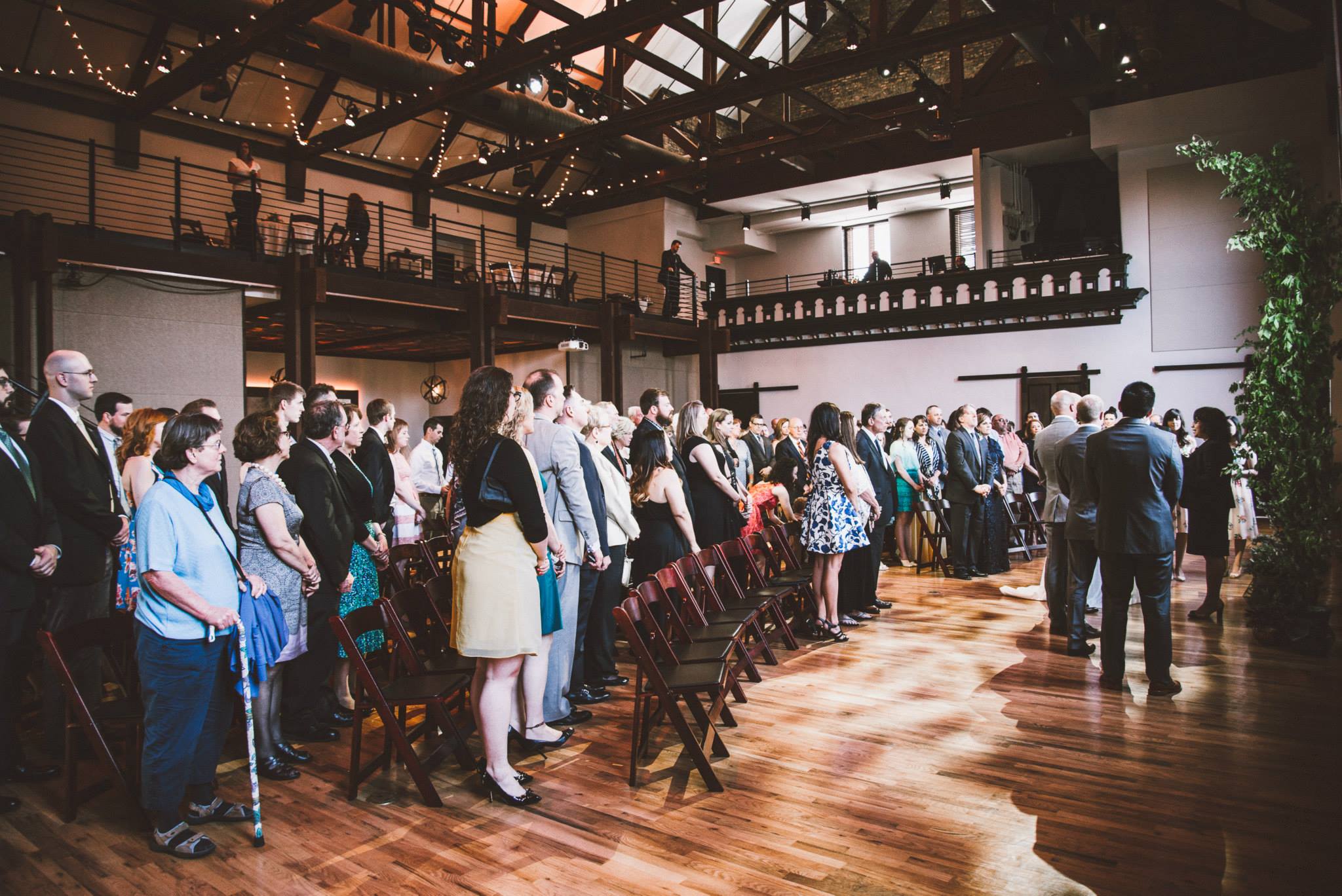 Guests Standing at Wedding Ceremony