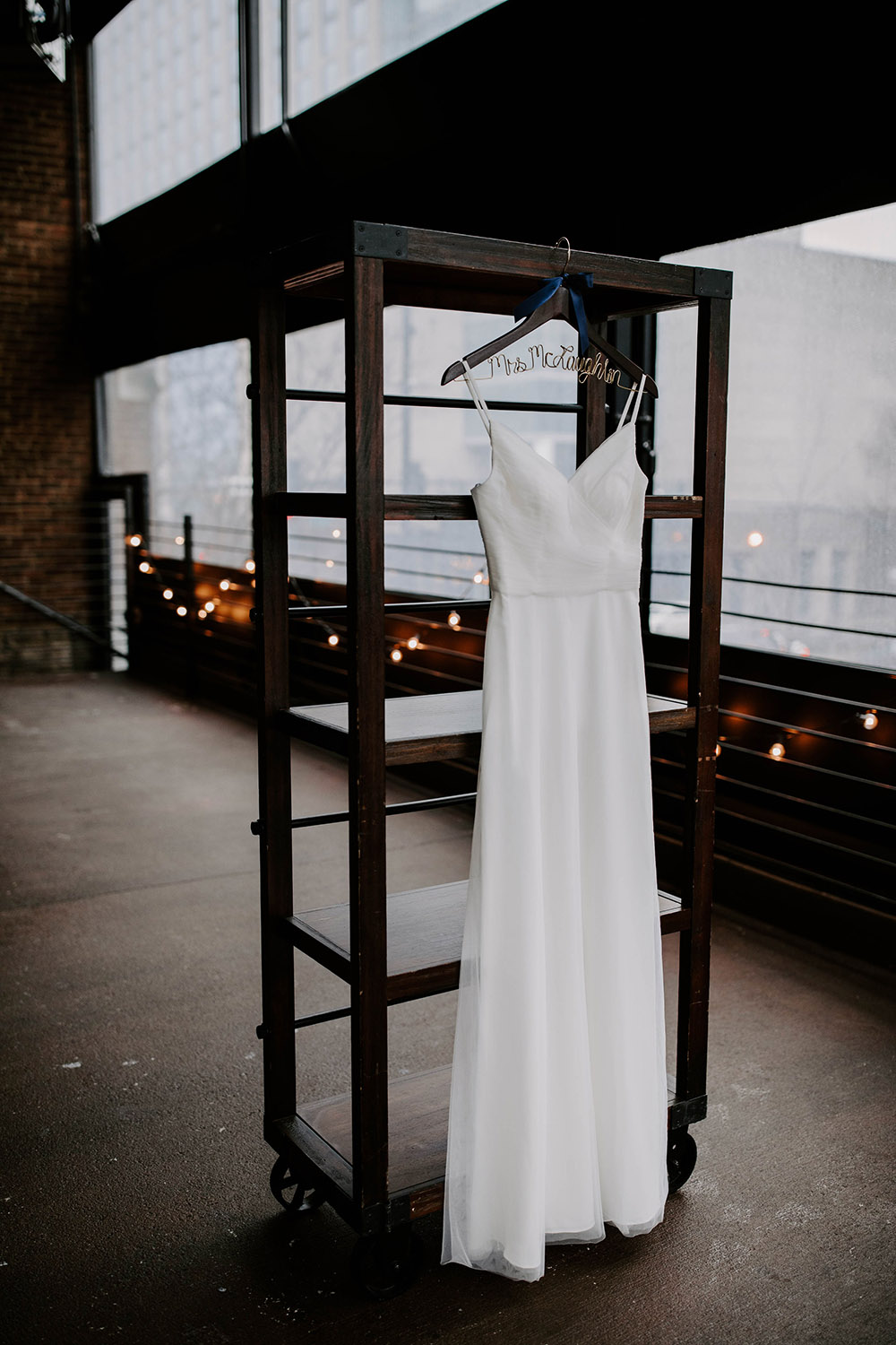 Wedding Dress Hanging on Shelf