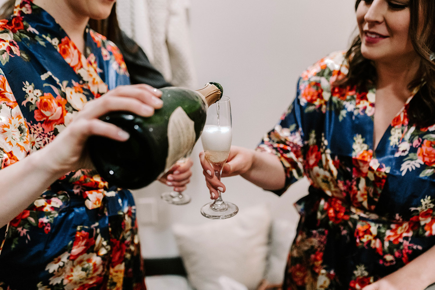 Bridesmaids Pouring Champagne