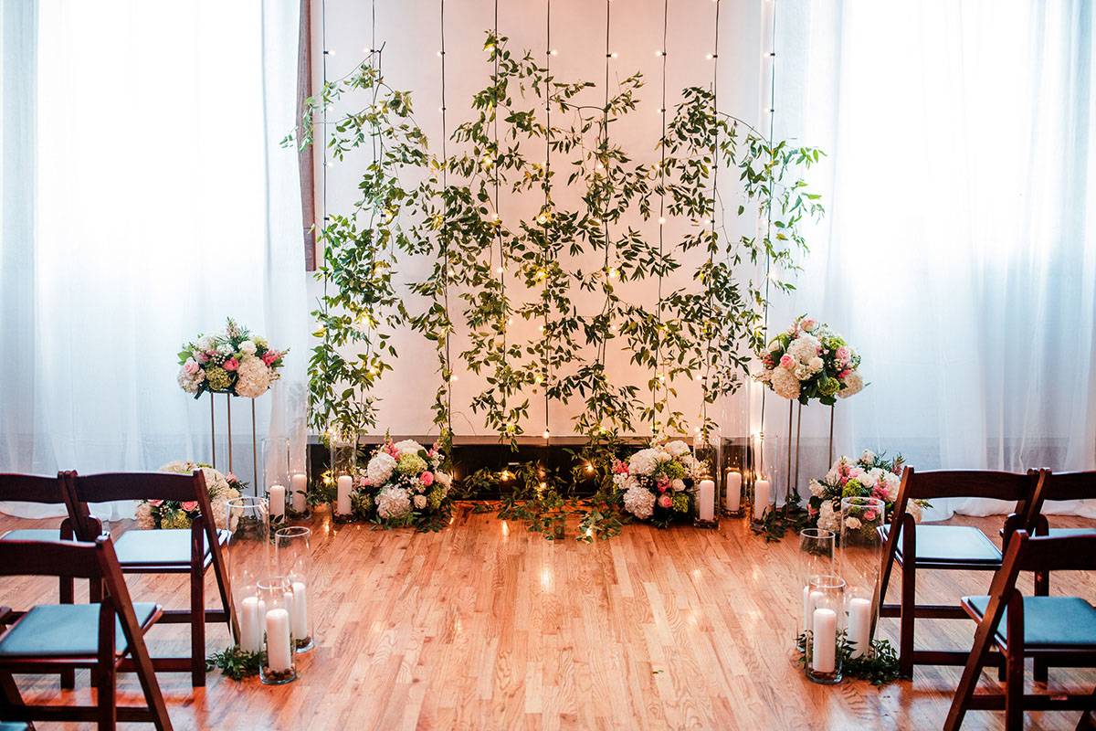 Romantic Wedding Ceremony Floral Altar With String Light Backdrop