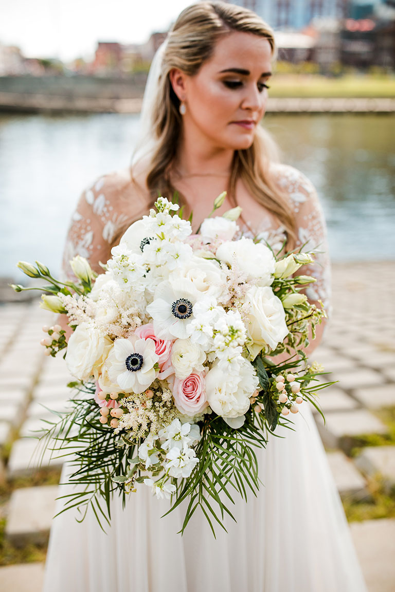 Lizzy Holding Romantic Wedding Bouquet