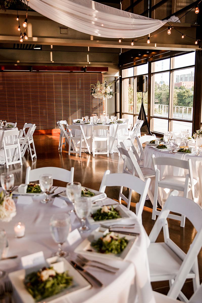 White Tables and Reception Seating with Salads at Place Settings