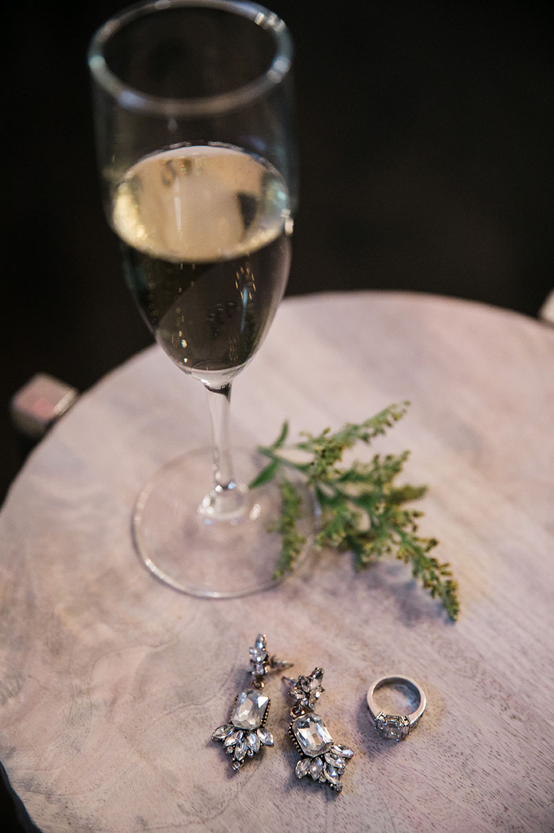 Glass of Champagne and Bridal Jewelry