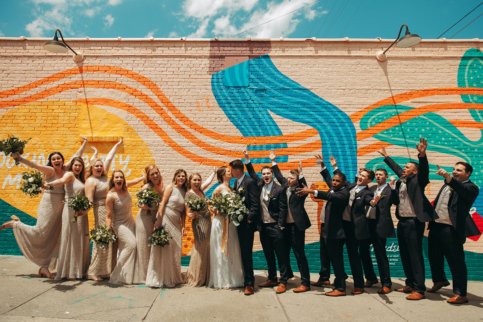 Lauren and David With Wedding Party In Front of Madewell Mural