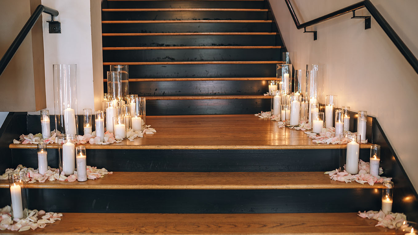 White Candles and Rose Petals on Bell Tower's Interior Staircase