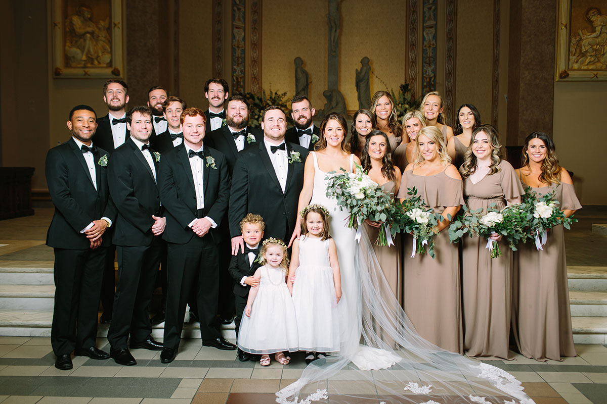 Molly and Blake Posing with Wedding Party