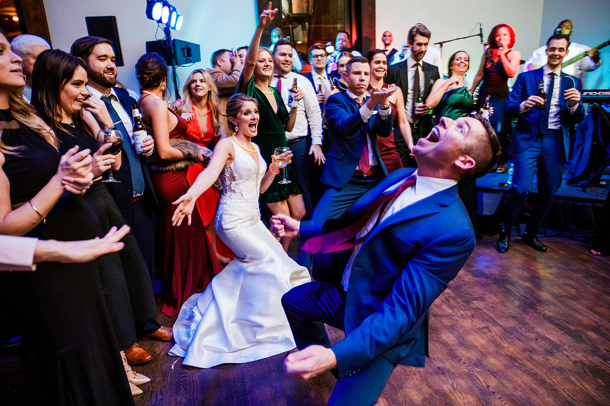 Jenna and Dave Dancing with Guests during Wedding Reception