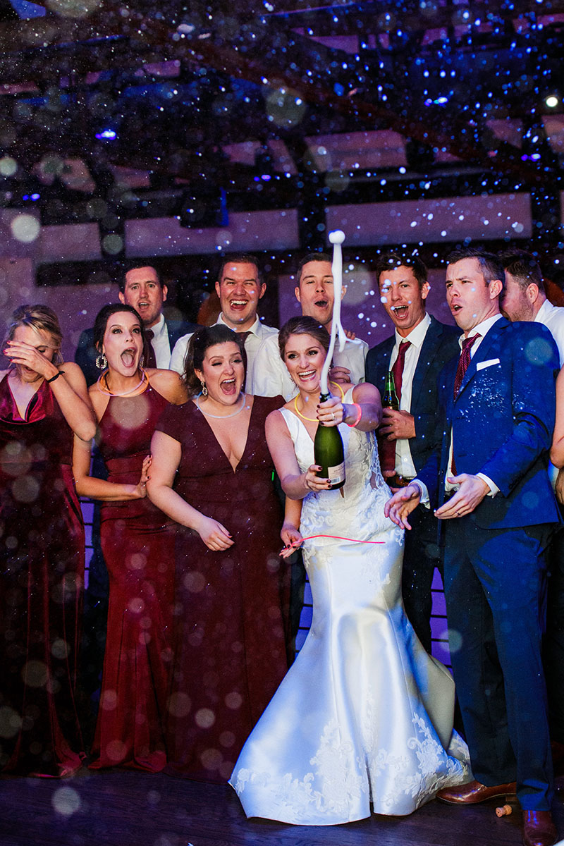 Jenna Popping Champagne with Wedding Guests