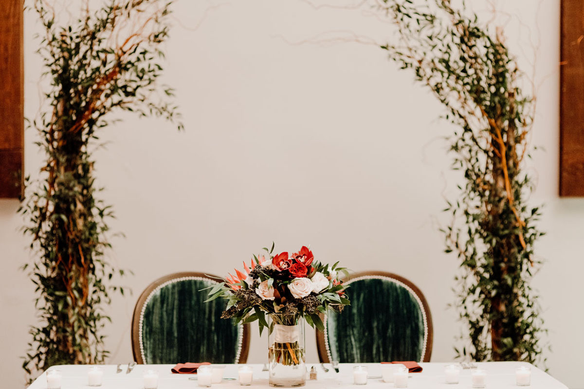 Boho-Inspired Wedding Sweetheart Table with Velvet Chairs