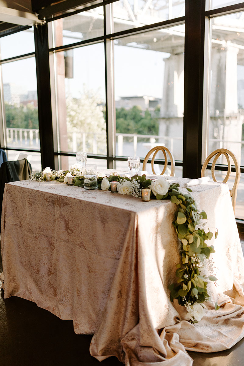 Chic Summer Wedding Sweetheart Table with metallic linen