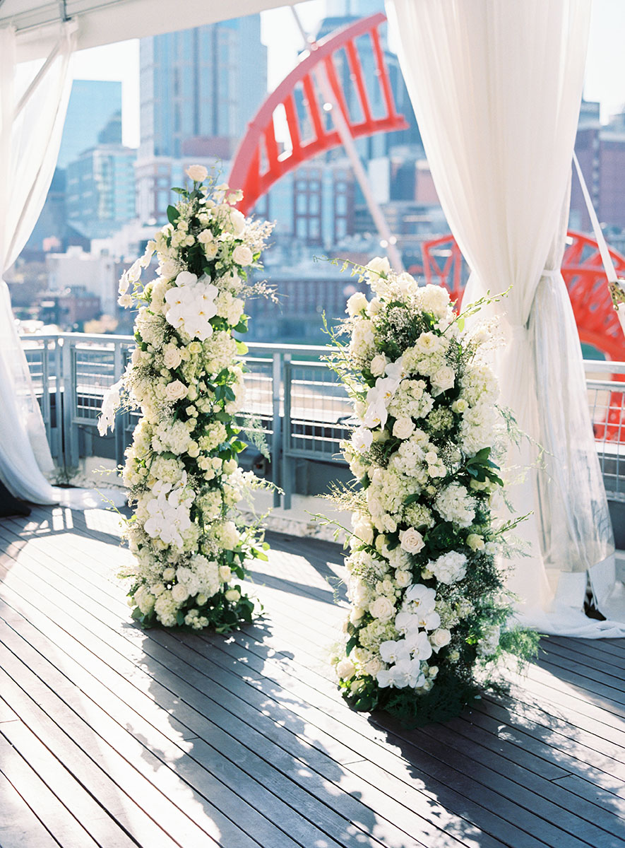 Modern Floral Arrangement for rooftop wedding ceremony altar