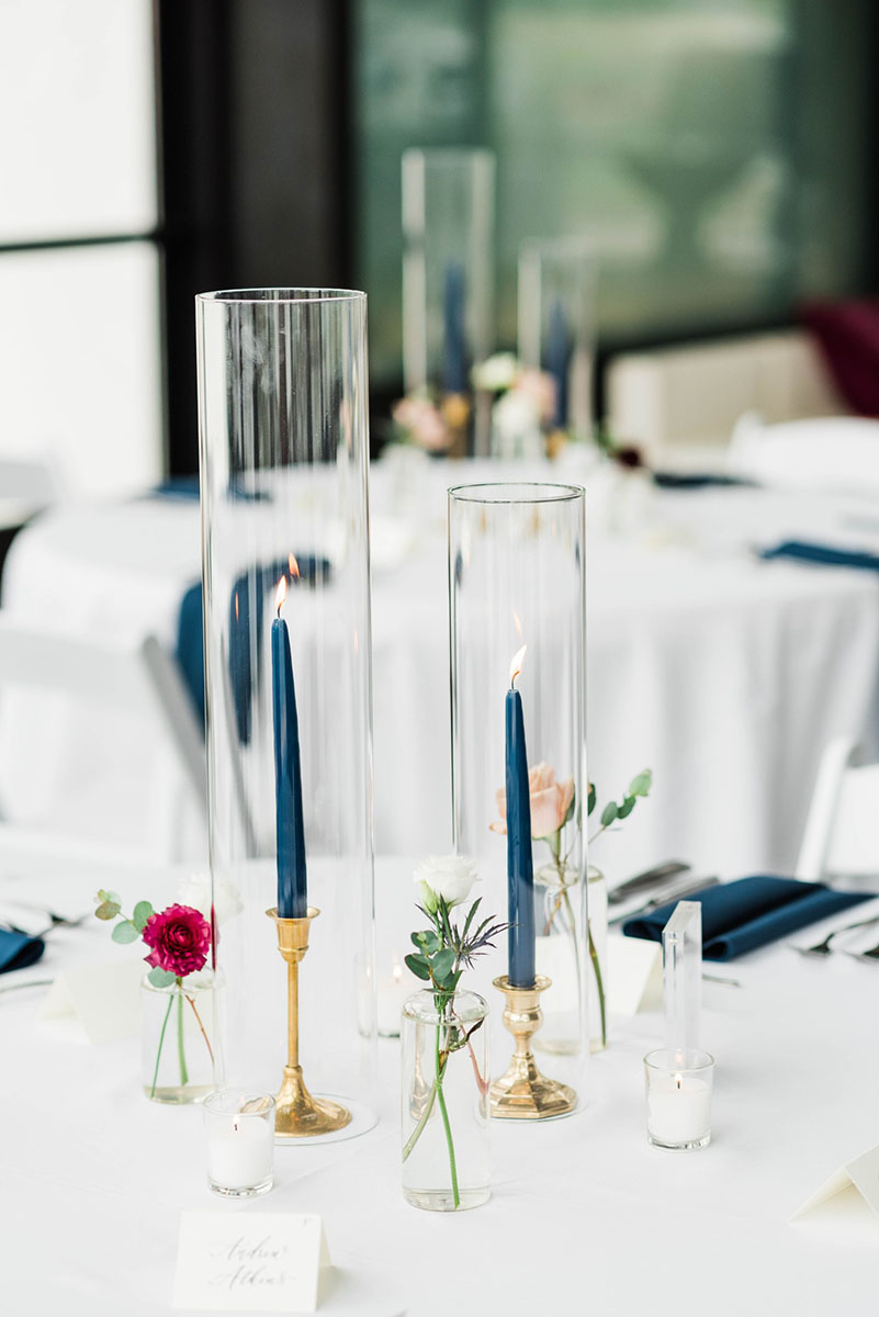 Spring Wedding Reception Centerpiece with Navy Blue Taper Candles