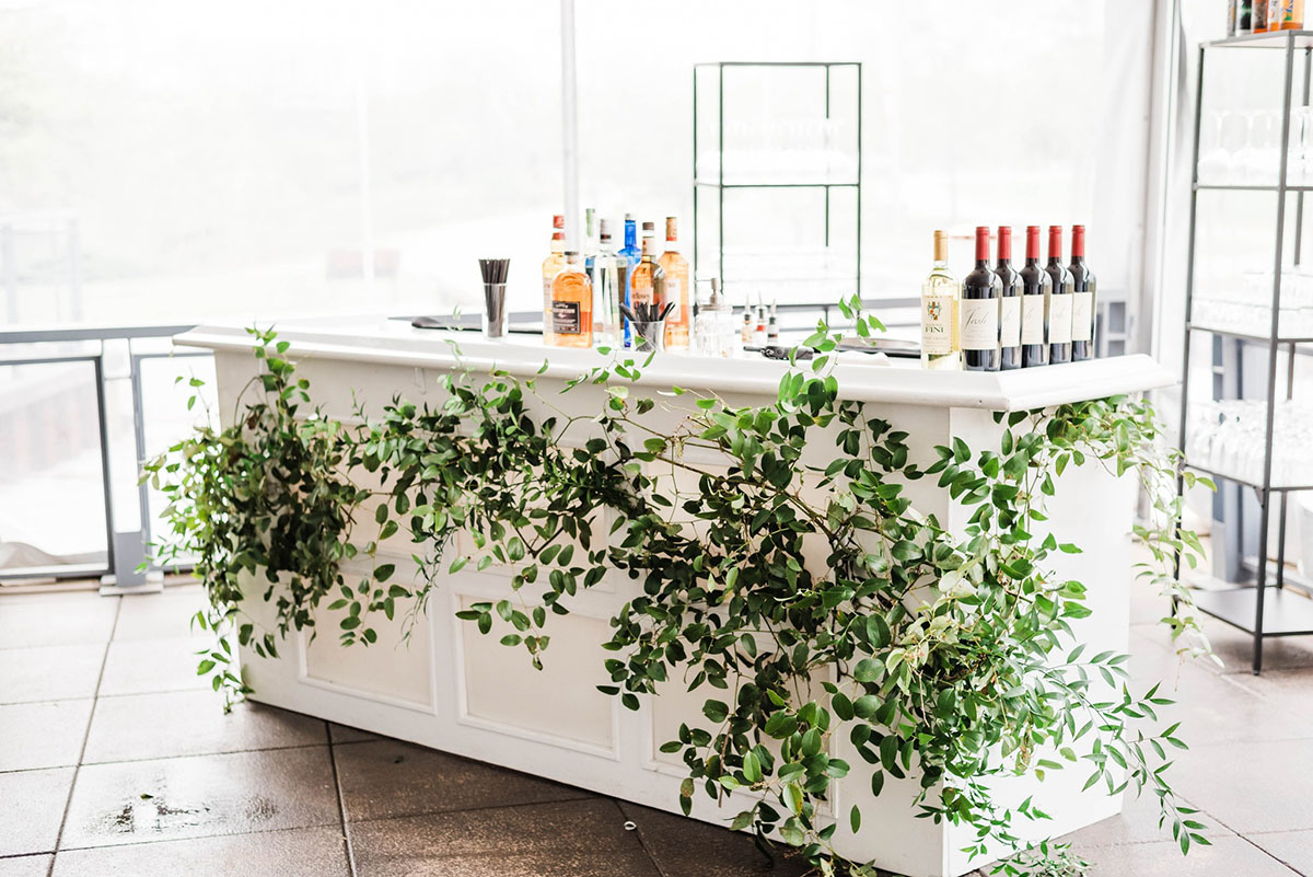 Spring Wedding Reception Bar Covered in Greenery