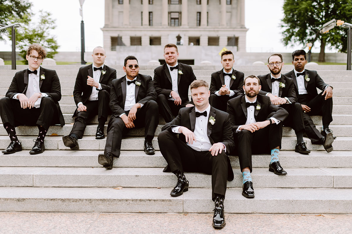 Patrick and His Groomsmen pose on a downtown Nashville staircase in classic black tuxedos