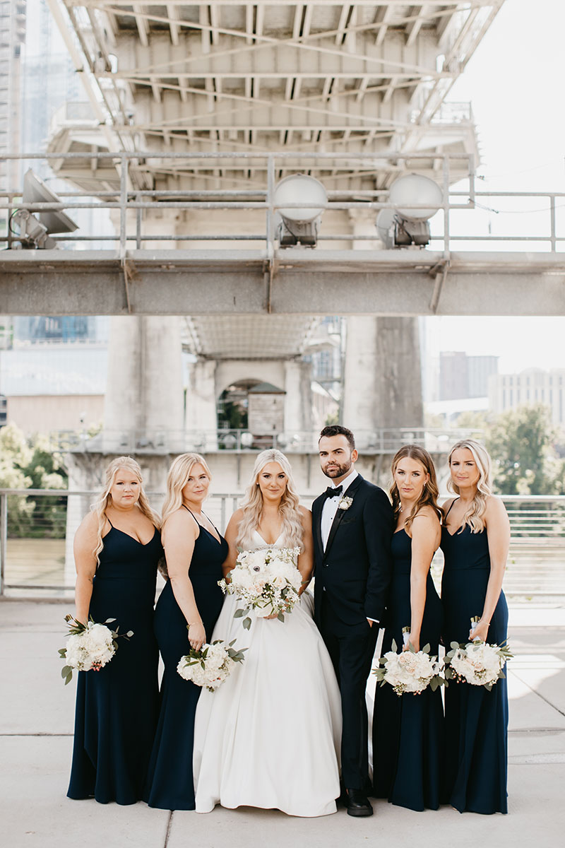 Cassidy Posing with Mixed Bridal Party Wearing Black