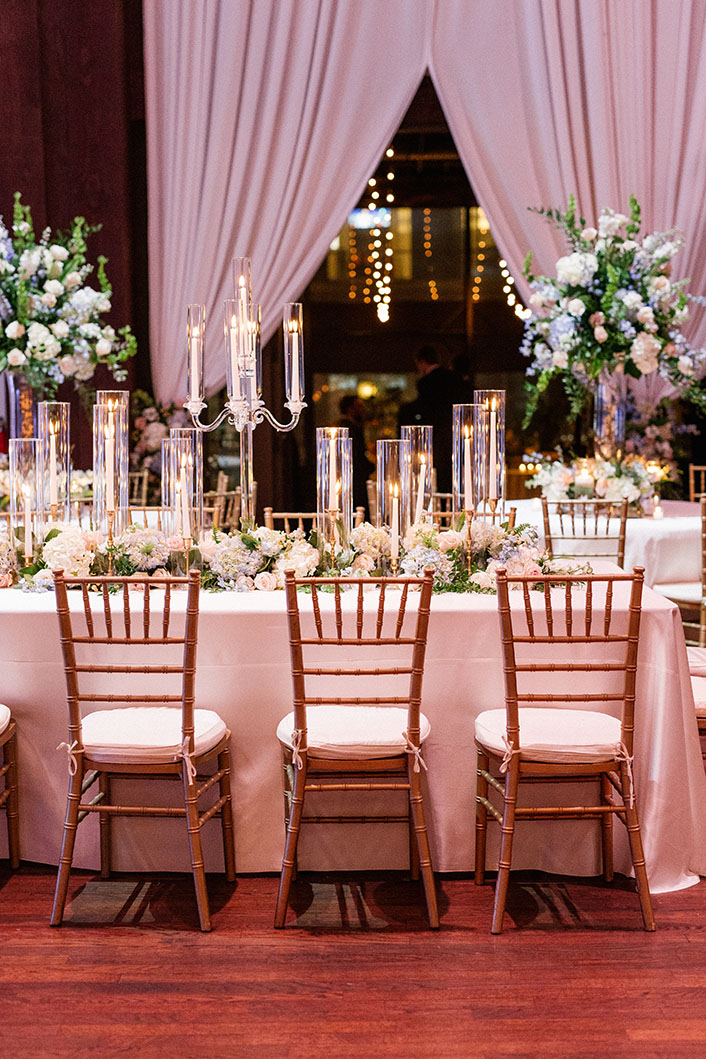 Elegant Wedding Reception Table with Gold Taper Candles and Crystal Candelabras