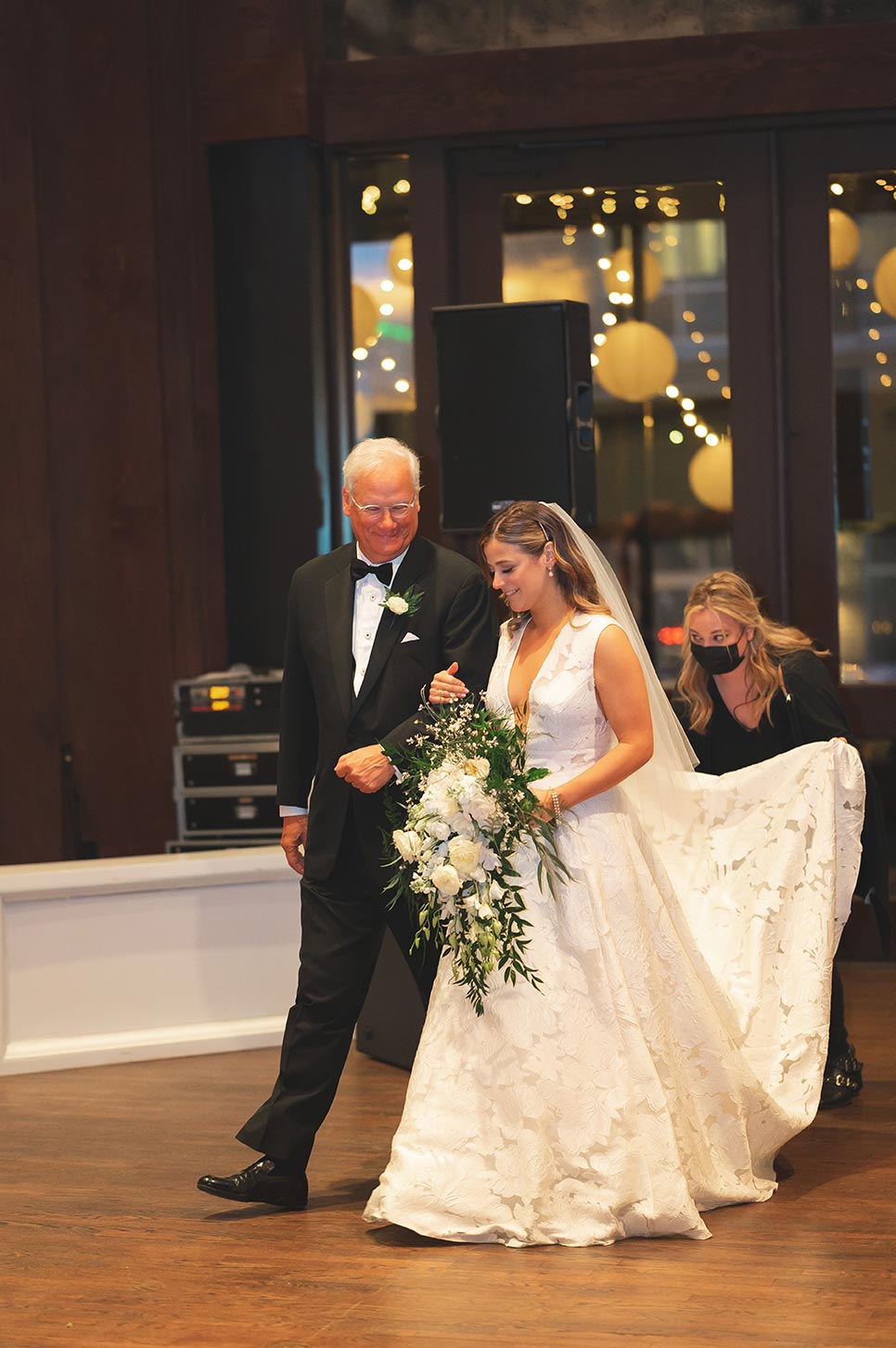 Father and daughter entrance, father in back tux, Mary the bride holding floral bouquet