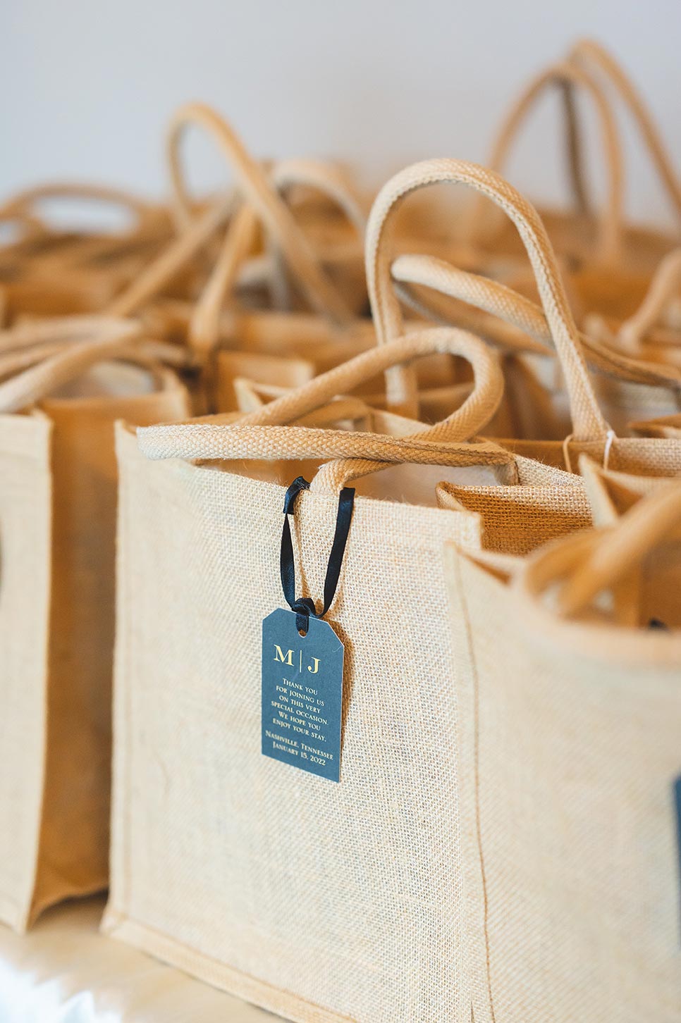 Wedding guest favors in brown reusable totes