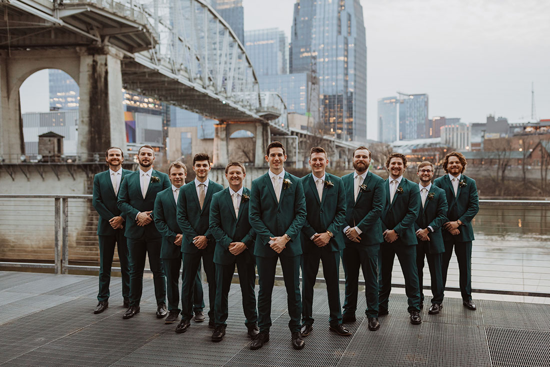 Groomsmen in Blue Suits Standing Outside