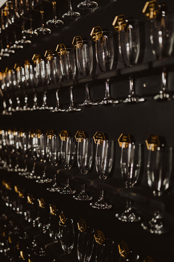 Champagne Wall with Place Cards on Glasses