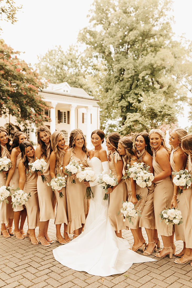 Classic Bridal Party in Champagne Colored Dresses and White Florals