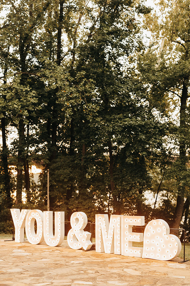 You and Me marquee sign on the patio at the Estate at Cherokee Dock