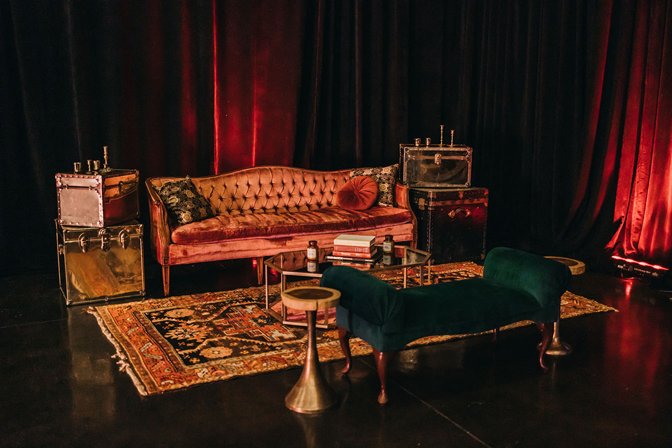 Lavish Vintage After Party Lounge Area with Velvet Sofa and Gold Decor