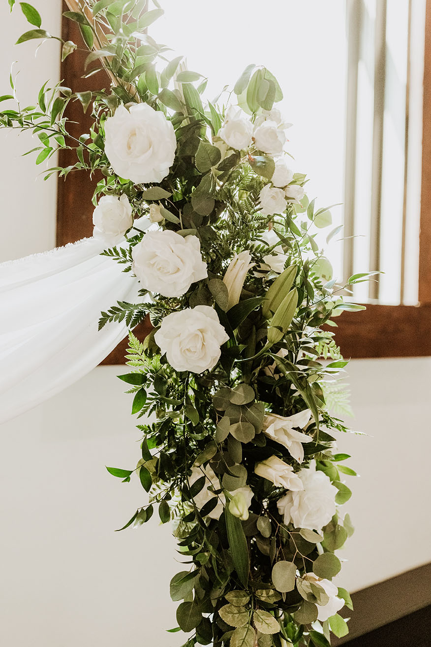 greenery floral arch with white florals