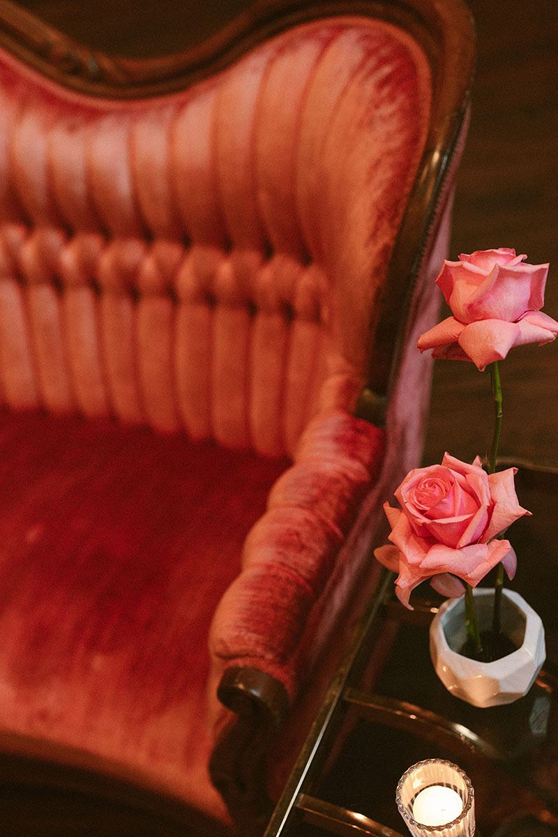 Pink velvet vintage sofa with pink roses