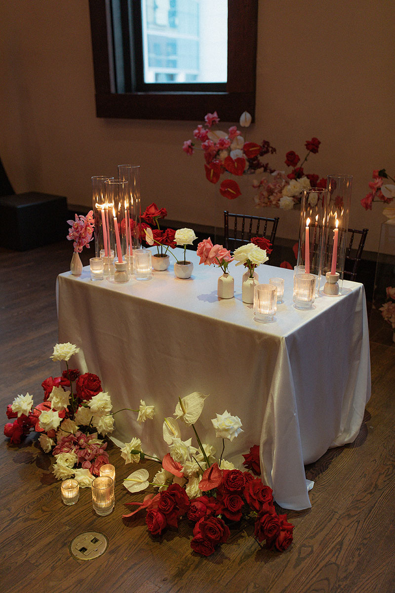 Romantic pink and red wedding sweetheart table