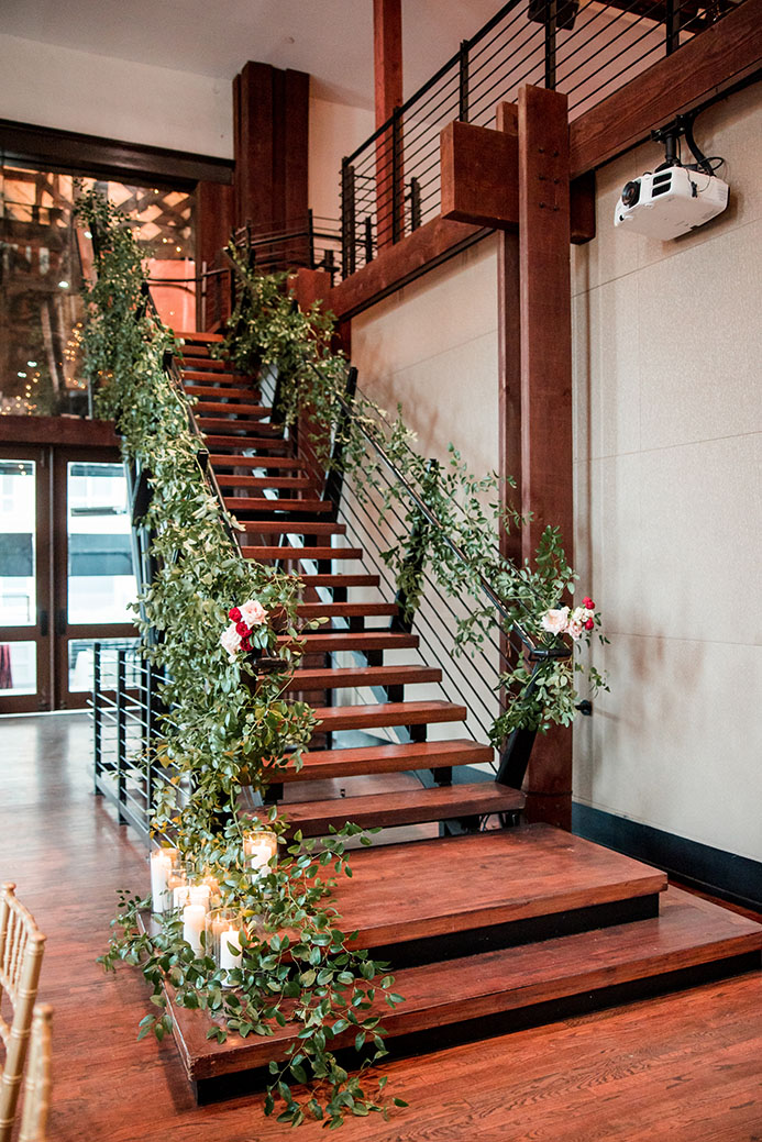 The Bell Tower Stairs with Greenery and Florals on Rails