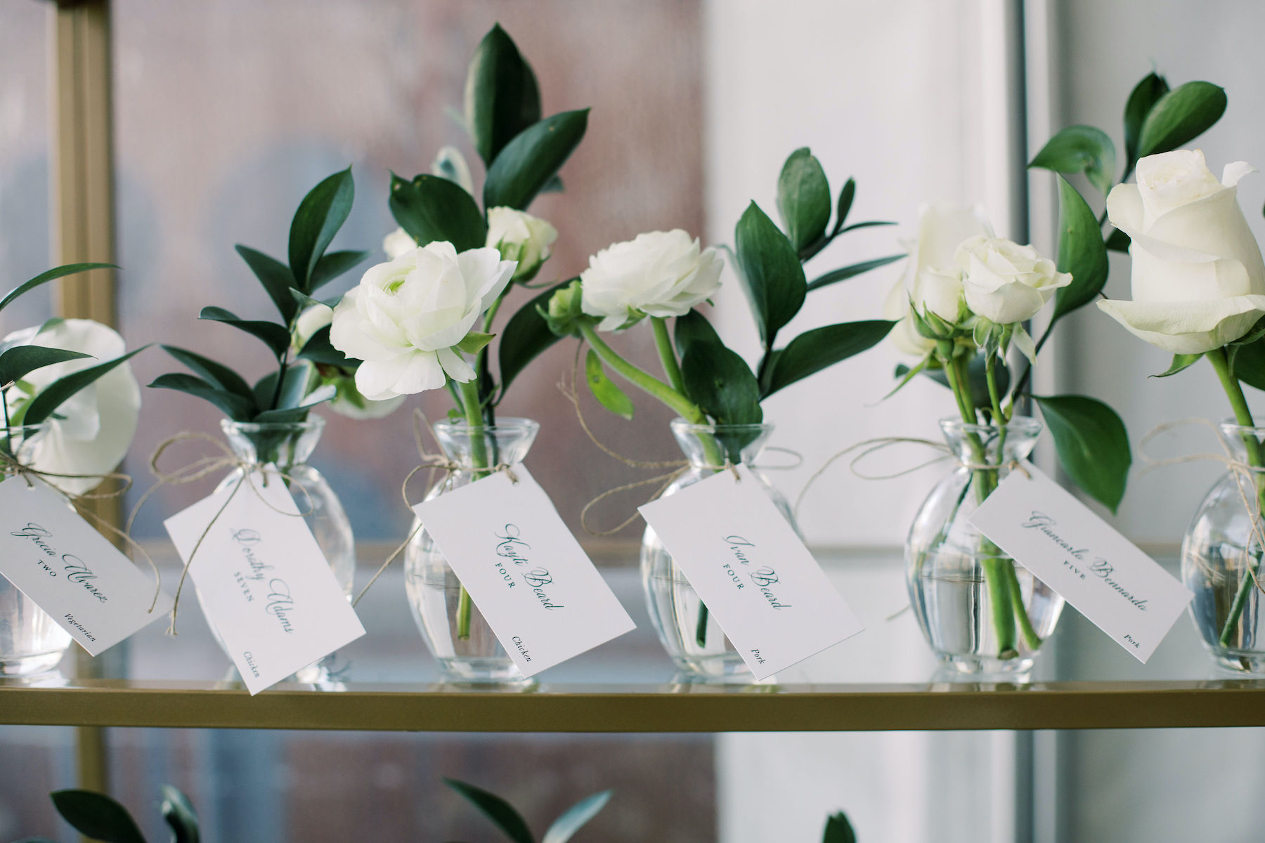 White floral bud vase escort cards